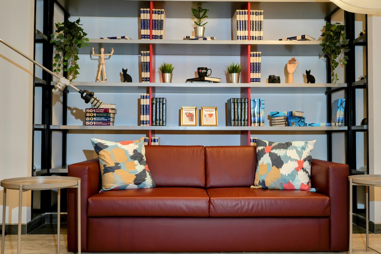 Lounge set with leather sofa and bookshelves