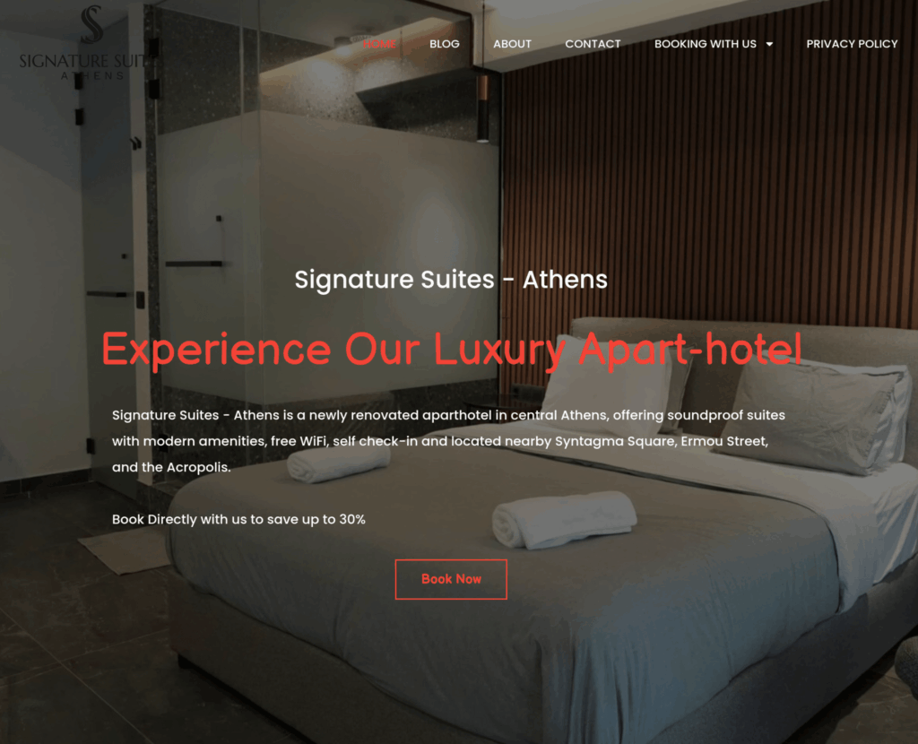 Homepage of the Signature Suites Athens aparthotel website, with a Book Now button over a bedroom photo